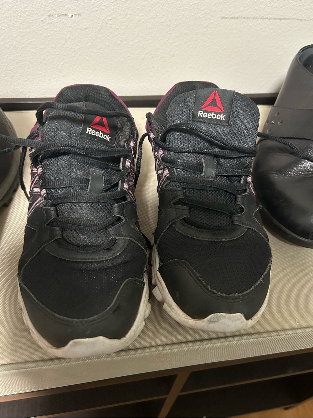 Reebok Women’s Black Sneakers with Pink Accents